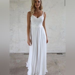 White A line wedding dress. Wore it for an hour. It’s been dry cleaned!